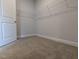 Walk-in closet with neutral carpet, white walls and wire shelving for organization at 1590 Pecan Drive # 45, Nashville, NC 27856