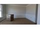 Dining room featuring decorative molding and a window, ready for new owners to add their personal touch at 1590 Pecan Drive # 45, Nashville, NC 27856