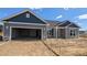 Newly constructed home with a two-car garage and a frame for a concrete driveway and walkway at 1590 Pecan Drive # 45, Nashville, NC 27856