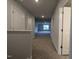 Hallway view with neutral paint, carpet, and bright lights at 1590 Pecan Drive # 45, Nashville, NC 27856