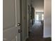 Hallway providing access to the kitchen, bedrooms, and bathrooms at 1590 Pecan Drive # 45, Nashville, NC 27856
