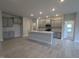 Modern kitchen featuring gray cabinets, stainless steel appliances, and a large center island at 1590 Pecan Drive # 45, Nashville, NC 27856