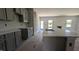 Beautiful kitchen featuring gray cabinets, countertops, and views of the backyard at 1590 Pecan Drive # 45, Nashville, NC 27856