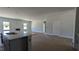 Open-concept living room and kitchen boasts lots of natural light and neutral color palette at 1590 Pecan Drive # 45, Nashville, NC 27856