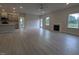 Open-concept living room featuring a fireplace, ceiling fan, light hardwood floors and plenty of natural light at 1590 Pecan Drive # 45, Nashville, NC 27856