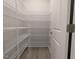 Walk-in pantry with white wire shelving and ample space for food storage at 1590 Pecan Drive # 45, Nashville, NC 27856
