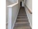 Carpeted staircase featuring neutral walls with white trim at 1590 Pecan Drive # 45, Nashville, NC 27856