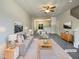 Stylishly staged living room with neutral tones, plush carpet, and an open floor plan for modern living at 1610 Oxleymare Dr, Raleigh, NC 27610
