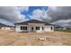 Rear view of new home showcasing a covered patio, windows, and vinyl siding at 1635 Pecan Drive # 26, Nashville, NC 27856