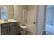 Well-lit bathroom features gray vanity, modern fixtures, and a shower-tub combo at 1635 Pecan Drive # 26, Nashville, NC 27856