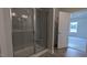 Bathroom featuring a shower with glass door and view into bedroom at 1635 Pecan Drive # 26, Nashville, NC 27856