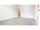 Empty bedroom with luxury vinyl plank flooring and walk-in closet at 1635 Pecan Drive # 26, Nashville, NC 27856