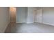 Carpeted bedroom with closet and door at 1635 Pecan Drive # 26, Nashville, NC 27856