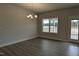 Bright dining area with modern chandelier and wood flooring with lots of natural light at 1635 Pecan Drive # 26, Nashville, NC 27856