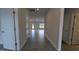 A hallway with gray wood-look floors, and white doors leads to other rooms at 1635 Pecan Drive # 26, Nashville, NC 27856