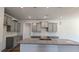 A kitchen with gray cabinets, granite counters, and a center island, well-lit by modern lighting at 1635 Pecan Drive # 26, Nashville, NC 27856
