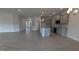 Open kitchen and living area, gray cabinets, granite countertops, and stainless steel appliances at 1635 Pecan Drive # 26, Nashville, NC 27856