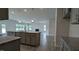 Kitchen with granite countertops, stainless appliances, island, and open living area at 1635 Pecan Drive # 26, Nashville, NC 27856