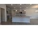 The kitchen features gray cabinets, granite counters, a center island, and modern lighting at 1635 Pecan Drive # 26, Nashville, NC 27856