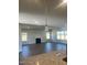 Open floor plan connecting kitchen to living room with fireplace and hardwood floors at 1635 Pecan Drive # 26, Nashville, NC 27856
