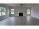 Spacious living room with high ceilings, hardwood floors, a fireplace, and large windows at 1635 Pecan Drive # 26, Nashville, NC 27856