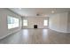 Bright and spacious living room with fireplace, ceiling fan and large windows at 1635 Pecan Drive # 26, Nashville, NC 27856
