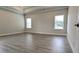 Main bedroom featuring luxury vinyl plank flooring, tray ceiling and neutral paint at 1635 Pecan Drive # 26, Nashville, NC 27856