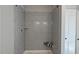 New shower with gray subway tile and a corner bench at 1635 Pecan Drive # 26, Nashville, NC 27856