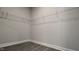 Empty walk-in closet with wire shelving and wood-look flooring provides ample storage at 1635 Pecan Drive # 26, Nashville, NC 27856