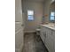 Bathroom featuring a white vanity, toilet, and shower with window at 1640 Pecan Drive # 44, Nashville, NC 27856