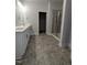 The bathroom features a vanity, storage closet and a glass enclosed shower at 1640 Pecan Drive # 44, Nashville, NC 27856