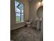 Bathroom features a pedestal sink, toilet, and a large window providing natural light at 1640 Pecan Drive # 44, Nashville, NC 27856