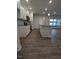 Open kitchen with island featuring granite counters, stainless appliances and wood flooring at 1640 Pecan Drive # 44, Nashville, NC 27856