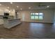 Bright open living room and kitchen area with wood flooring and natural light at 1640 Pecan Drive # 44, Nashville, NC 27856