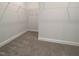 Walk-in closet with carpet and multiple wire shelves providing ample storage space at 1640 Pecan Drive # 44, Nashville, NC 27856