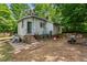 View of the rear of the house showing the backyard and access stairs at 1701 Sunset St, Roxboro, NC 27573