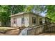 Charming single-story home featuring a ramp for accessibility and red window trim at 1701 Sunset St, Roxboro, NC 27573
