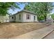 Charming single-story home featuring a ramp for accessibility and red window trim at 1701 Sunset St, Roxboro, NC 27573