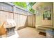 Private backyard area features a grill, gate, and is enclosed by a wood fence at 1714 Carson St, Raleigh, NC 27608