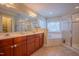 Spacious primary bathroom with double vanity, soaking tub, and walk-in shower for a spa-like experience at 1714 Carson St, Raleigh, NC 27608