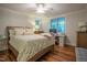 Bedroom with a bed, desk, hardwood floors, and a ceiling fan at 1714 Carson St, Raleigh, NC 27608
