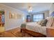 Comfortable bedroom with wood floors, ceiling fan, and natural light at 1714 Carson St, Raleigh, NC 27608