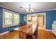 Charming dining room features wood floors, blue walls and connects to the kitchen at 1714 Carson St, Raleigh, NC 27608