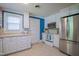 Bright kitchen with stainless steel appliances, tile backsplash and white cabinets at 1714 Carson St, Raleigh, NC 27608