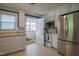 Bright kitchen with stainless steel appliances, tile backsplash and white cabinets at 1714 Carson St, Raleigh, NC 27608