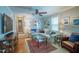 Comfortable living room featuring a hardwood floors, stylish furniture, ceiling fan and ample natural light at 1714 Carson St, Raleigh, NC 27608
