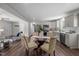 Elegant dining area adjacent to the kitchen, perfect for entertaining with a glass table and seating for four at 1734 Stage Rd, Durham, NC 27703