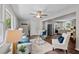 Open-concept living room showcasing hardwood floors, neutral tones, and a seamless transition to the kitchen and dining area at 1734 Stage Rd, Durham, NC 27703