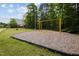 Community park featuring swings, a grassy field, and shade trees for outdoor recreation at 1734 Stage Rd, Durham, NC 27703