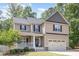 Beautiful two-story home with a welcoming front porch and a well-manicured lawn at 180 Long Grass Dr, Smithfield, NC 27577